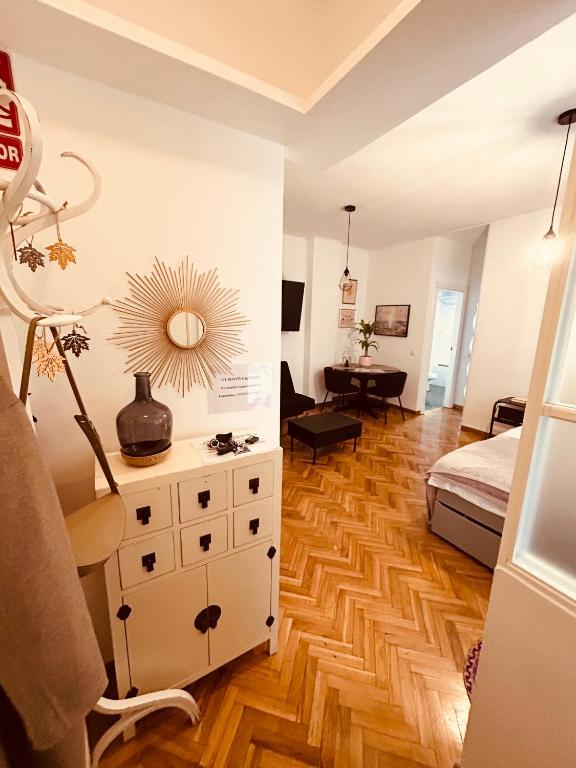 a bedroom with a bed and a dresser with a mirror at El rincón exquisito in Albacete