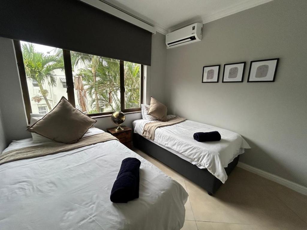 Postel nebo postele na pokoji v ubytování Beachfront Luxury 7 Chaka's Place Ballito