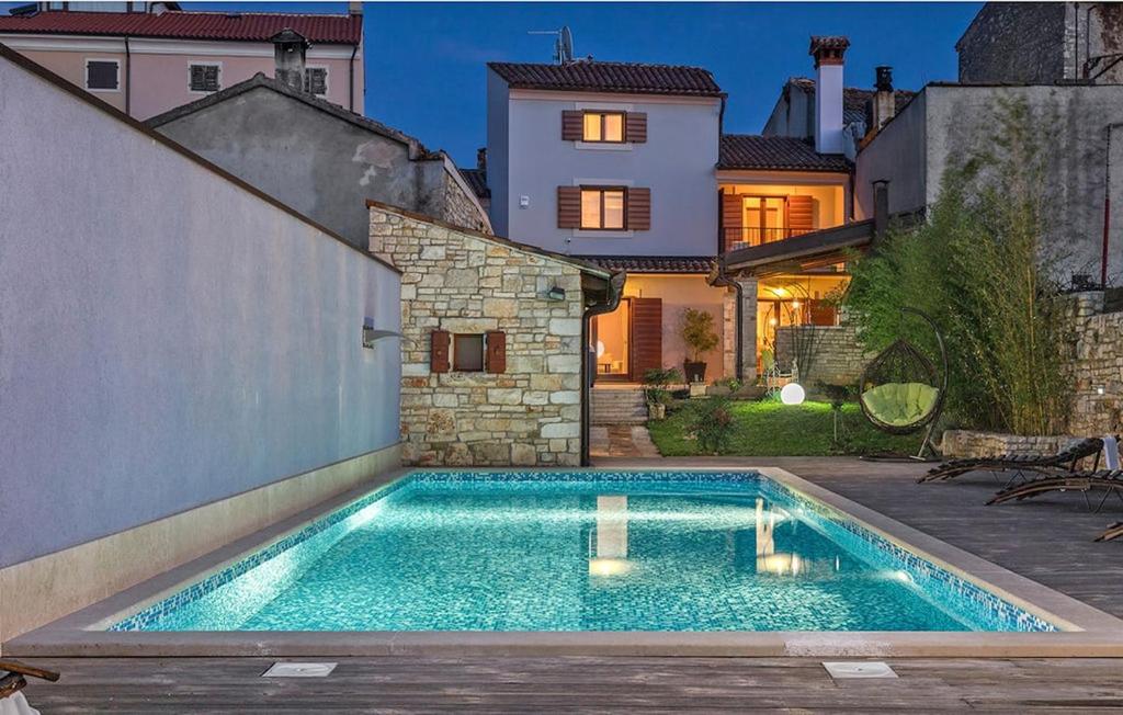 a swimming pool in the backyard of a house at Villa San Rocco with heated pool in Vodnjan