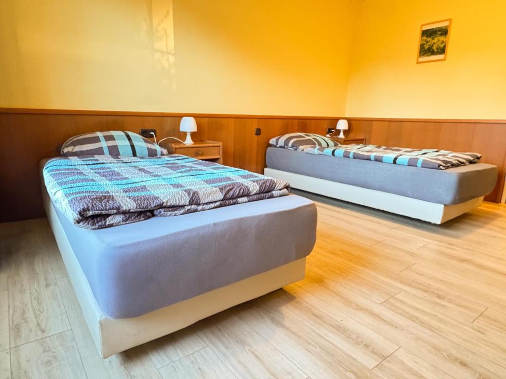 Postel nebo postele na pokoji v ubytování 33 - 4 Hotelkamer voor 2 gasten op de begane grond