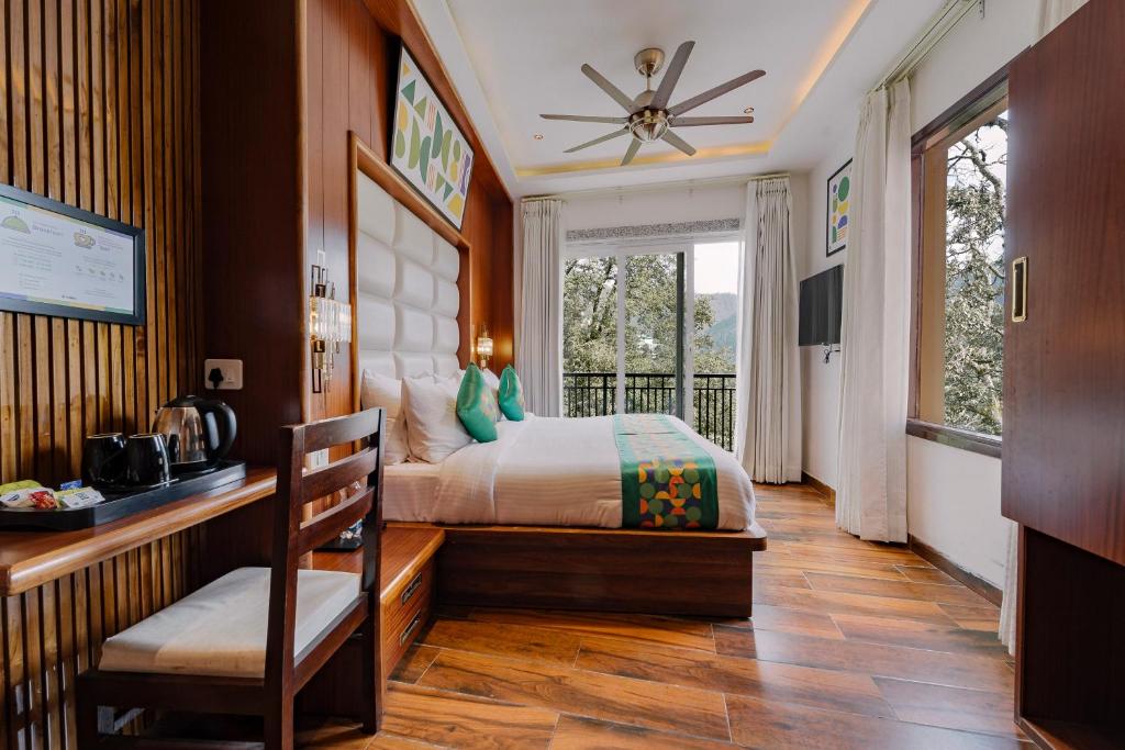 Ένα ή περισσότερα κρεβάτια σε δωμάτιο στο Treebo Hilldaar Dalhousie