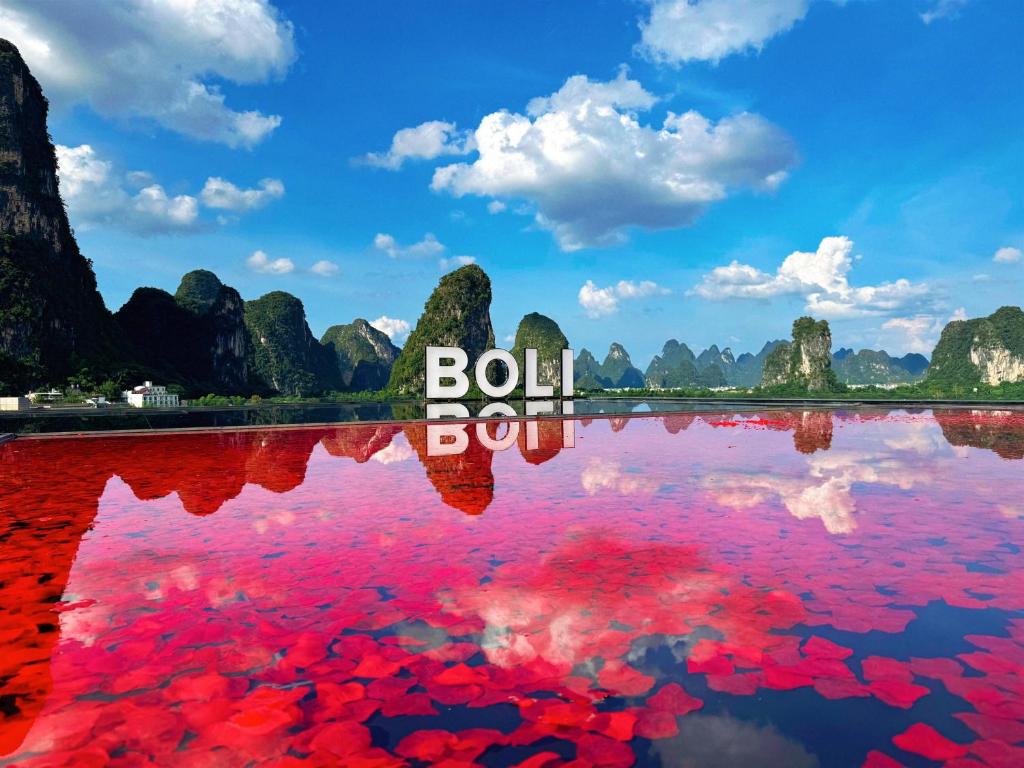 a body of water with the words bol bol bol at Shuitiao Boli Hotel (Yangshuo Shili Gallery Yulonghe Branch) in Gaotian