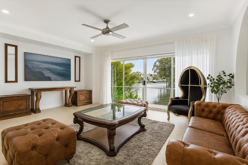 a living room with a couch and a coffee table at Creekside Manor - Spacious | Nature & Serenity - Holiday Home in Gold Coast
