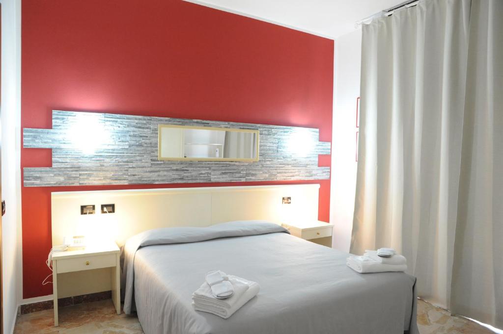 Postel nebo postele na pokoji v ubytování Hotel del Ponte