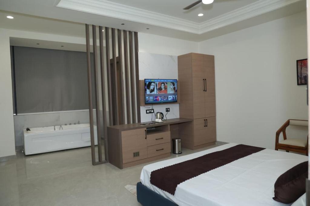 Ένα ή περισσότερα κρεβάτια σε δωμάτιο στο Den Inn