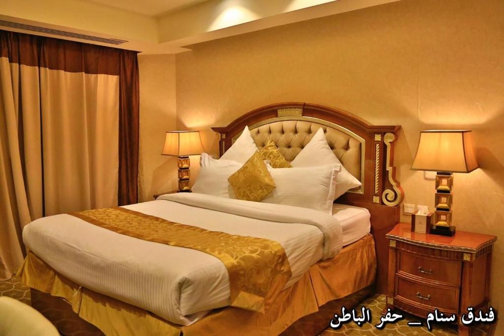 Ένα ή περισσότερα κρεβάτια σε δωμάτιο στο مدار سنام