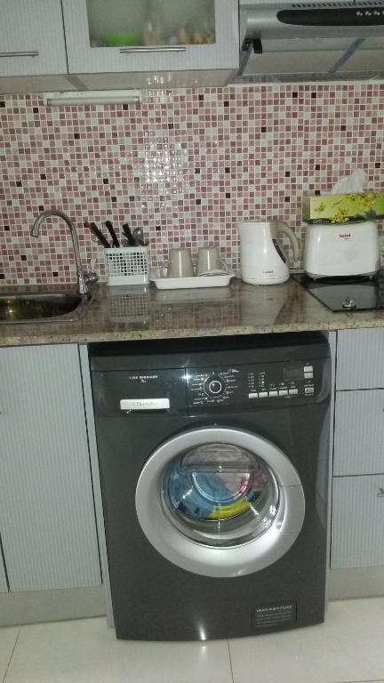 Kuchyň nebo kuchyňský kout v ubytování Khiang Talay Condo