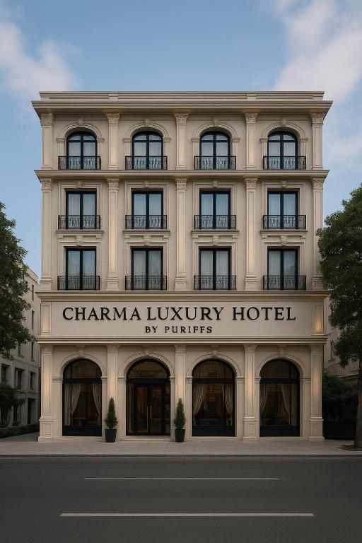 a large white building with a sign on it at Charma Luxury Hotel by Puriffs in Safranbolu