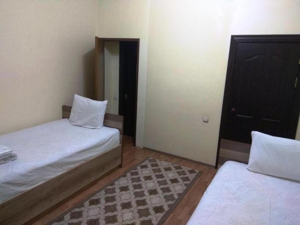 Postel nebo postele na pokoji v ubytování SAFAR hotel