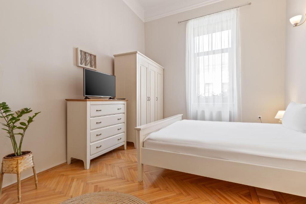 Postel nebo postele na pokoji v ubytování Elle Home