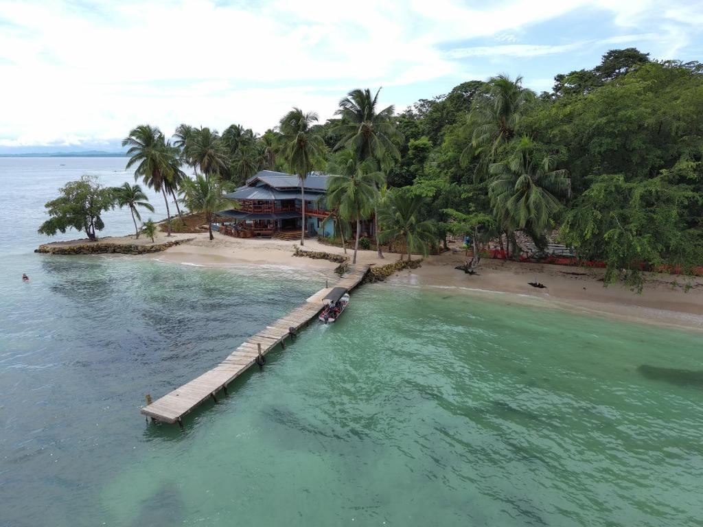 an aerial view of a resort on a beach at Bocas Beachfront Lodge Spacious Corner King Suite Ocean View Sand Level in Bocas del Toro