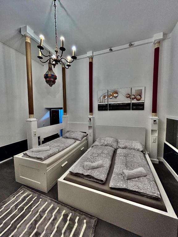 Ένα ή περισσότερα κρεβάτια σε δωμάτιο στο Vienna-Guestroom