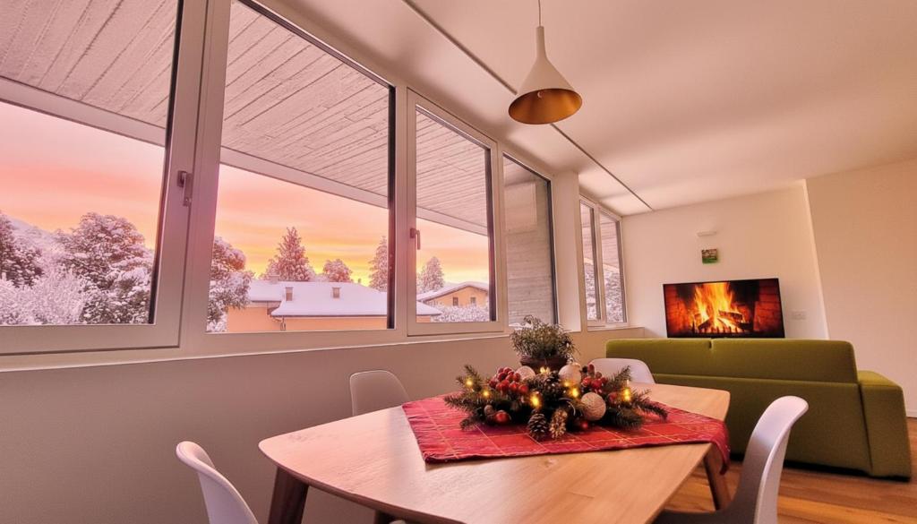 a dining room with a table and some windows at -Parcheggio Privato-Riscaldamento Pavimento-WiFi- zona OSPEDALE-CENTRO "COZY PANoRAMA" in Trento