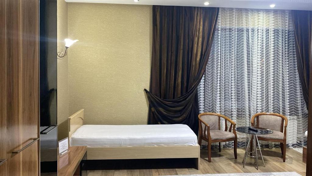 Ένα ή περισσότερα κρεβάτια σε δωμάτιο στο Seoul Hotel