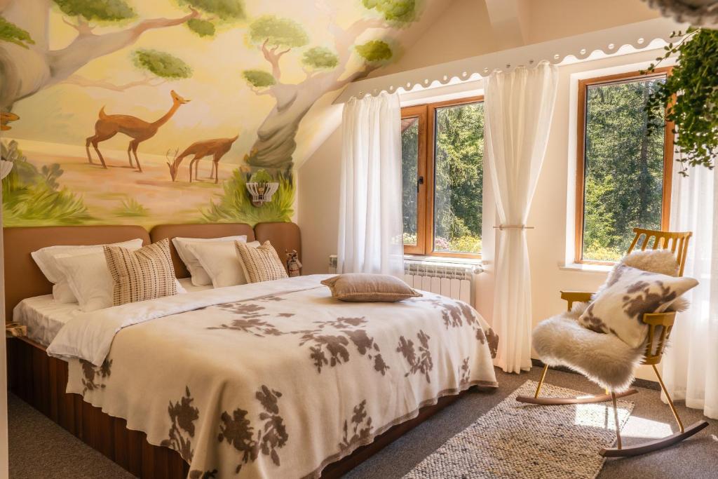 a bedroom with a bed with a painting on the wall at Kuker Hut - Хижа Кукер in Sofia
