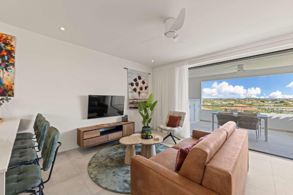 TV a/nebo společenská místnost v ubytování Caribbean Lounge - Aquamarine 4