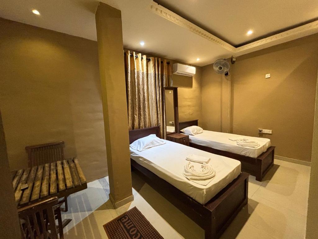 Postel nebo postele na pokoji v ubytování Airport City Hotel