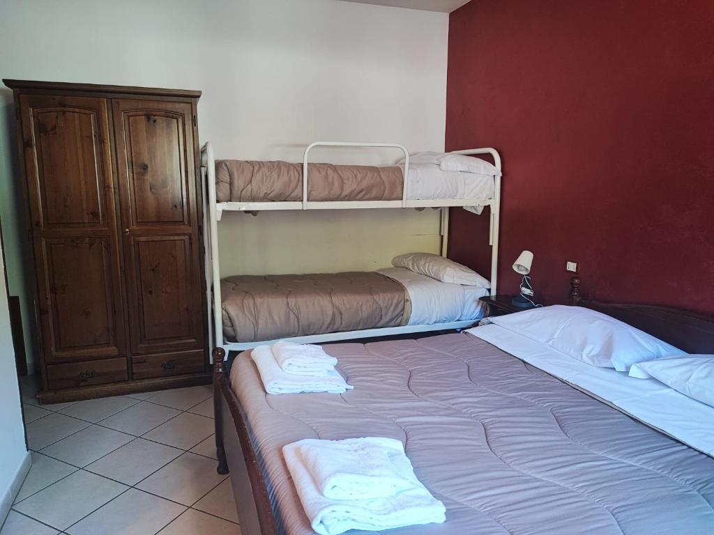 Ένα ή περισσότερα κρεβάτια σε δωμάτιο στο Il Rifugio