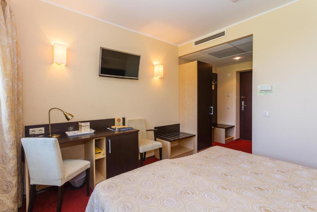 Televiisor ja/või meelelahutuskeskus majutusasutuses Hotel Rocca al Mare