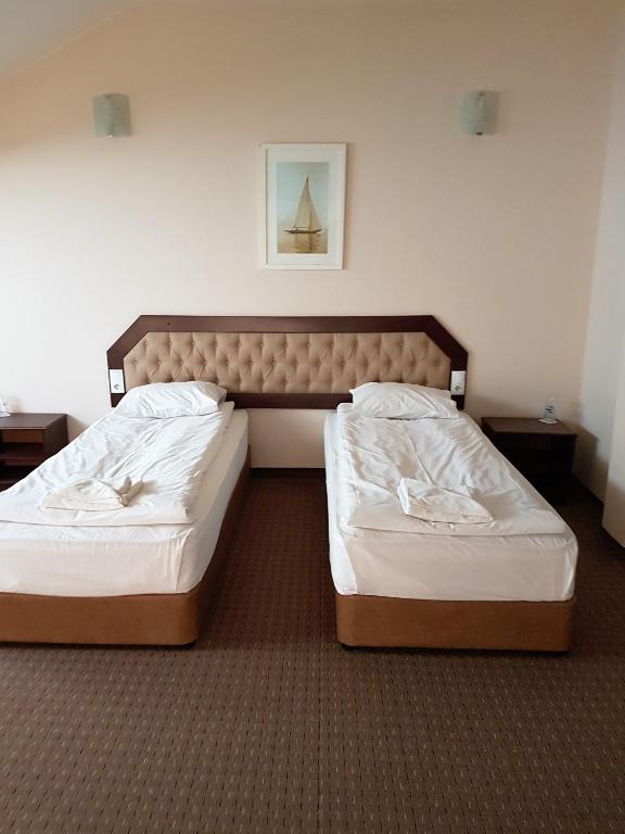 Postel nebo postele na pokoji v ubytování Hotel Podkovata