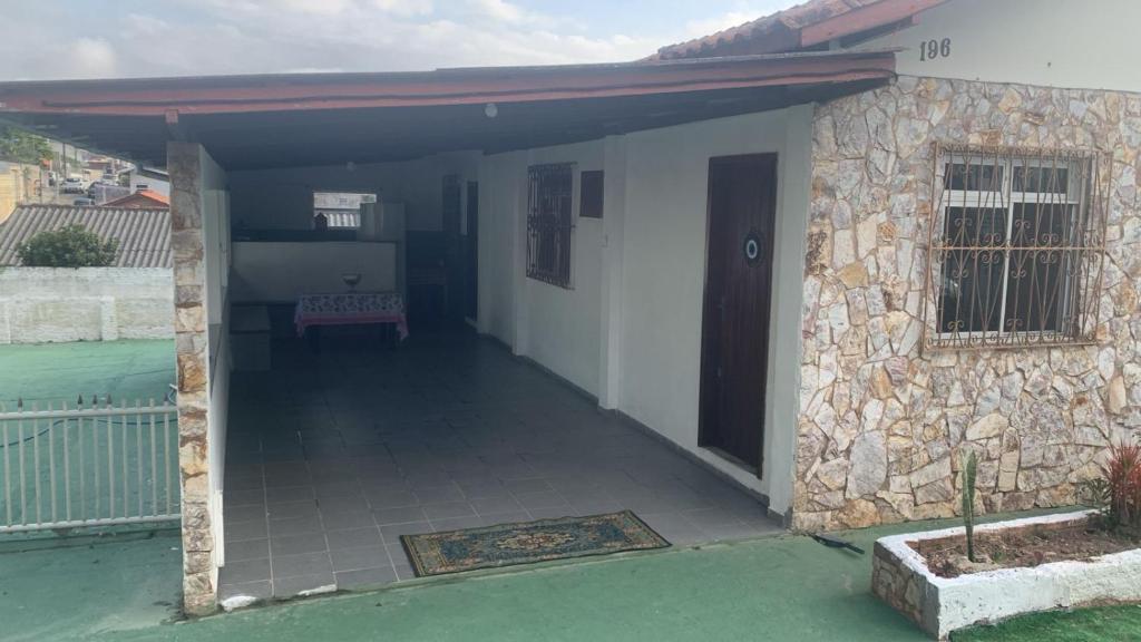 an open door of a house with a patio at Pousada da Magia in Florianópolis