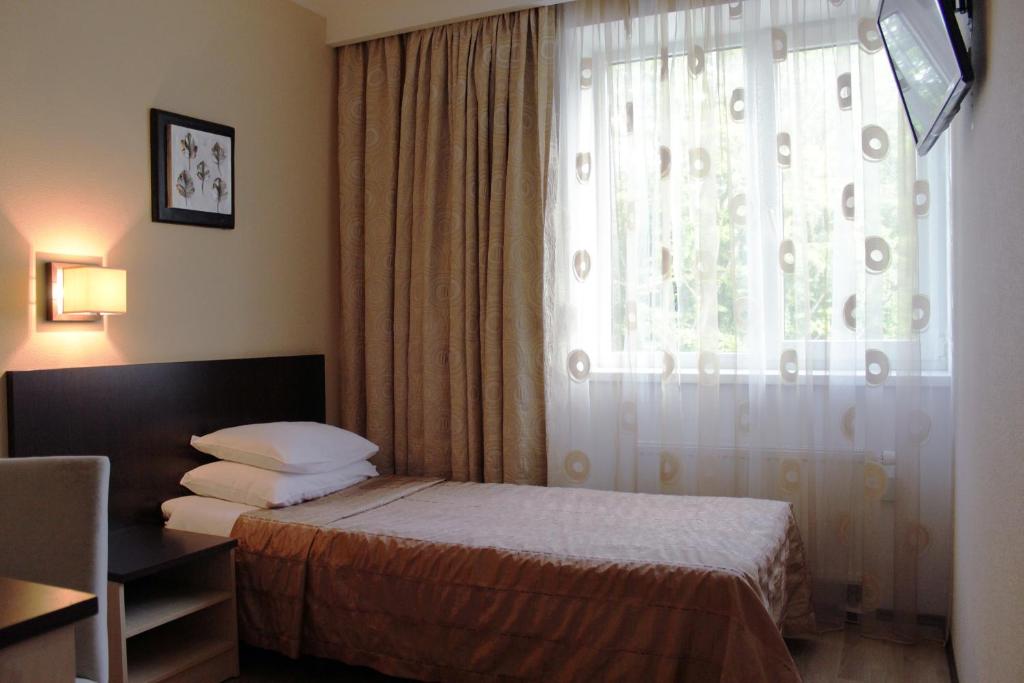 Voodi või voodid majutusasutuse Hotel Rocca al Mare toas