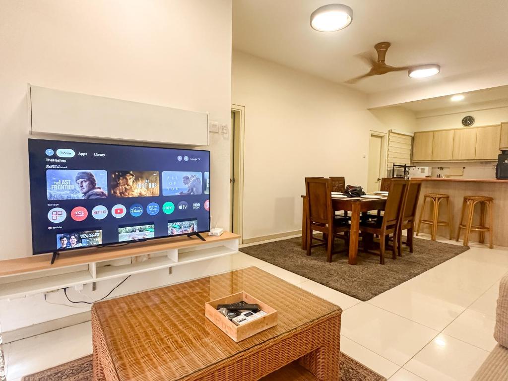 a living room with a large flat screen tv at Cozy Home TTDI Adina, Section 13, Shah Alam in Shah Alam