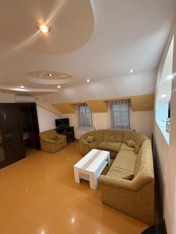 a living room with two couches and a coffee table at CENTRUM 22 RESIDENCE Ap II in Sibiu
