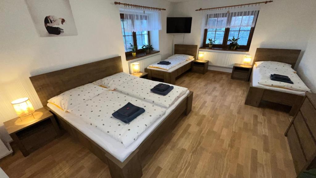 an overhead view of a room with two beds and windows at Apartmán Mája in Rumburk