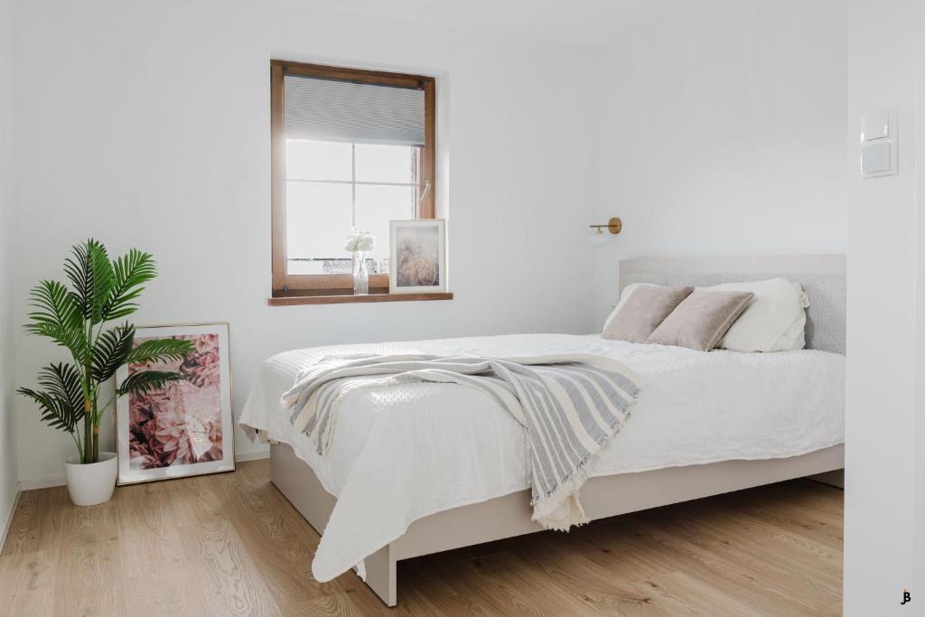 Postel nebo postele na pokoji v ubytování NiWA