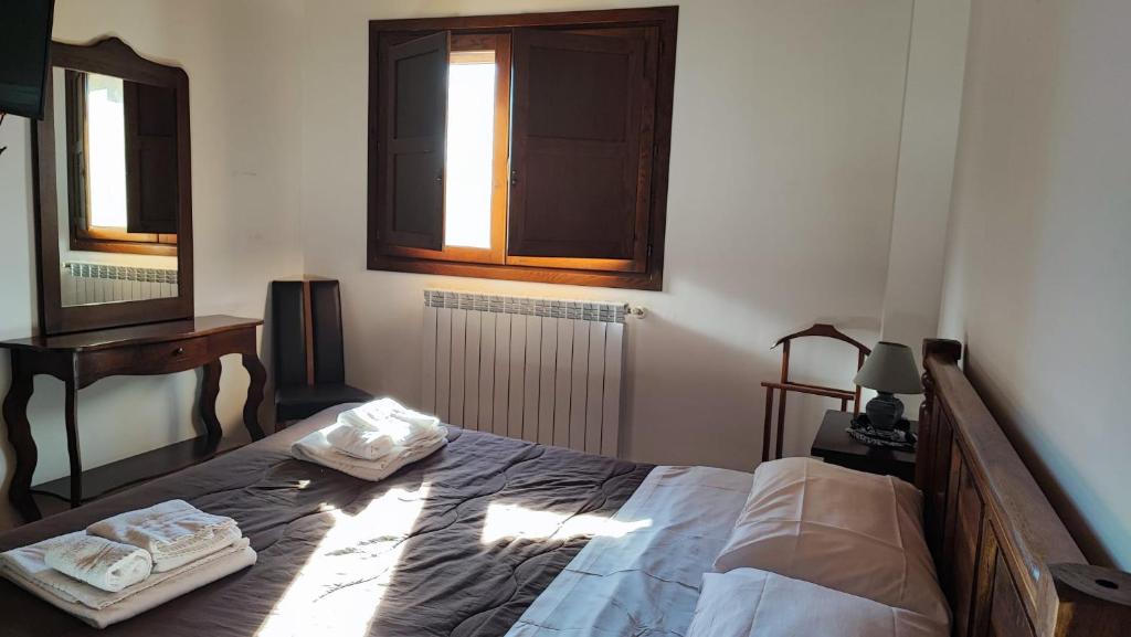 Ένα ή περισσότερα κρεβάτια σε δωμάτιο στο Hotel Il Feudo Dei Pierleoni