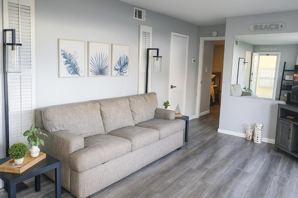 a living room with a couch and a table at Oceanfront Retreat Private Beach New Smyrna Beach in New Smyrna Beach