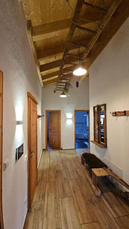 a living room with a couch and a wooden floor at Chalet Steinplatte in Reit im Winkl