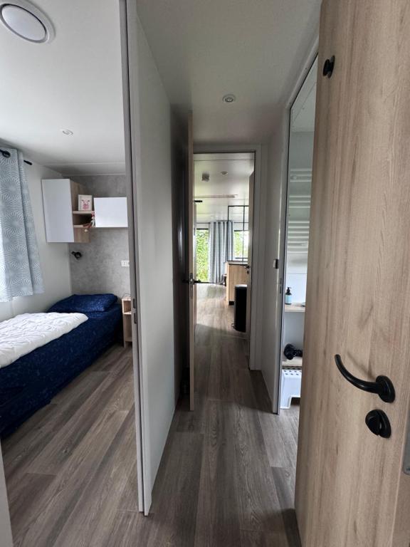 En eller flere senge i et værelse på Chalet See 19 mit Seeblick