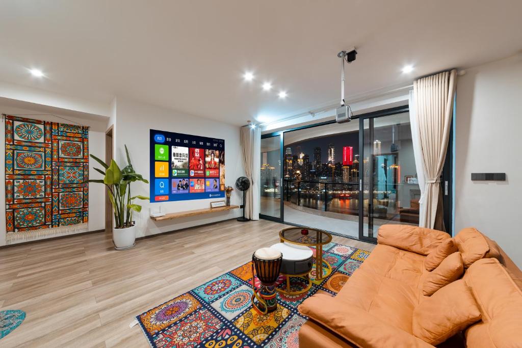 a living room with a couch and a flat screen tv at Ruyuan Riverside Boutique Hotel in Chongqing