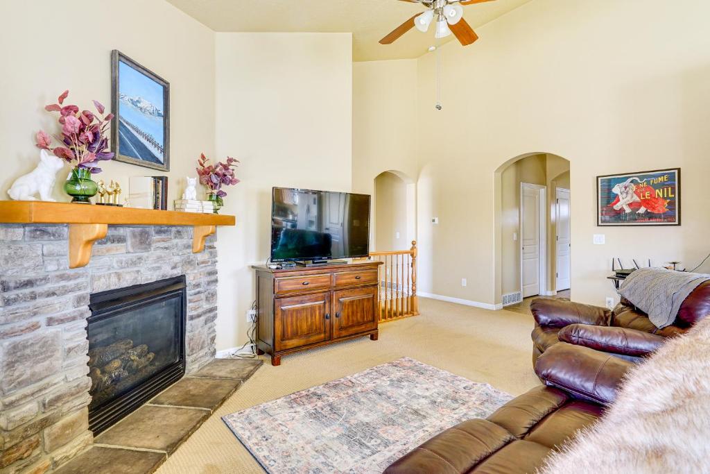 a living room with a couch and a fireplace at 3,600 Sq Ft, Large Fenced Yard Heber City Retreat in Heber City