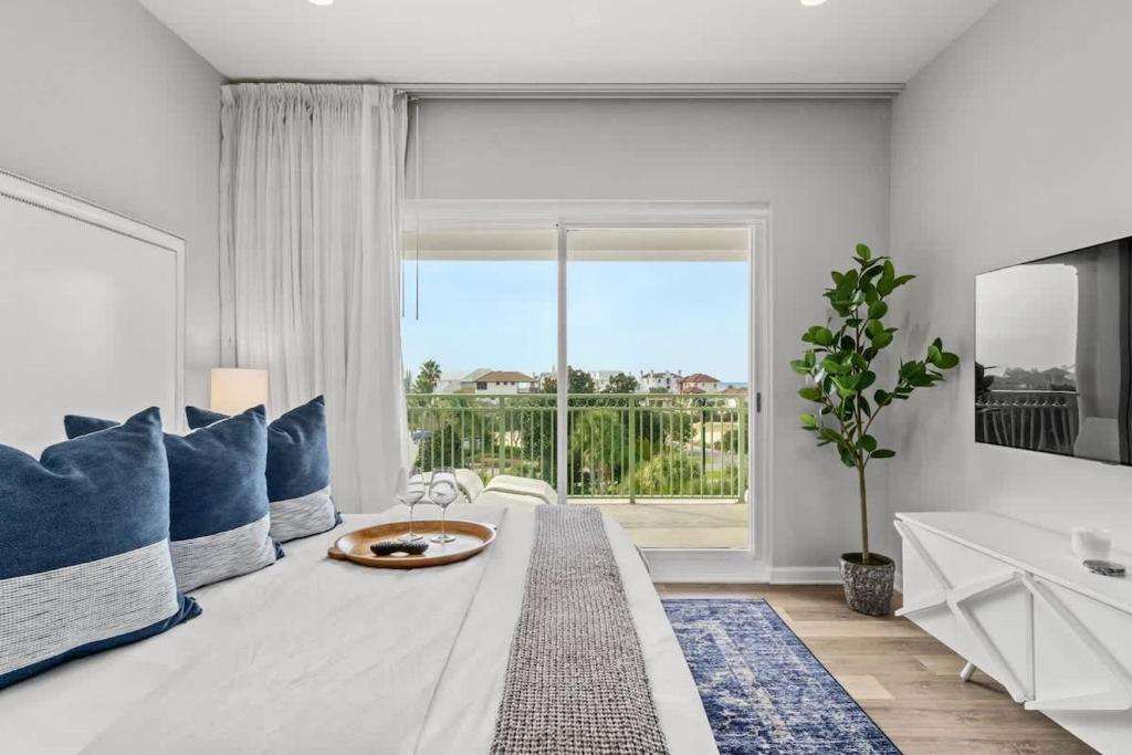 a living room with a couch and a large window at Inn at Seacrest Beach 409 in Inlet Beach