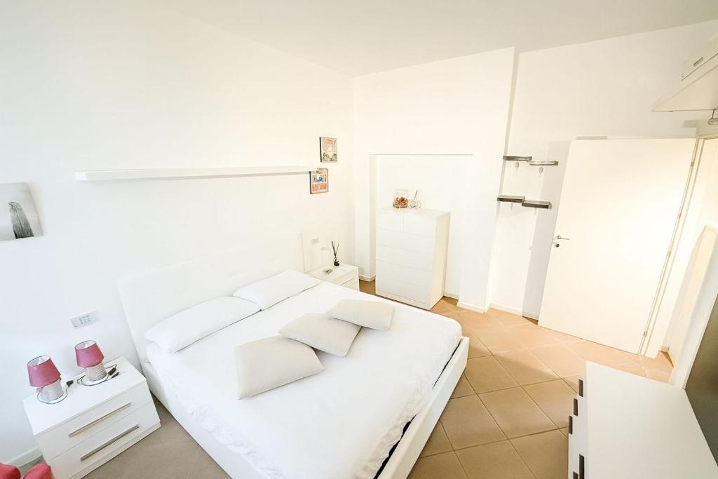 Ένα ή περισσότερα κρεβάτια σε δωμάτιο στο Grazioso appartamento a 2 passi dal centro