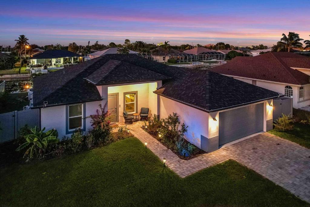 an overhead view of a house with a backyard at Into the Blue in Cape Coral Hospital Heliport