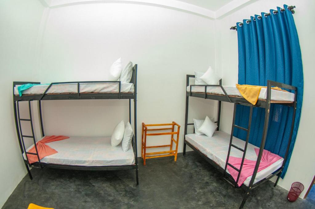 Ένα ή περισσότερα κρεβάτια σε δωμάτιο στο Tangalle Nomad Hub and Coworking Space