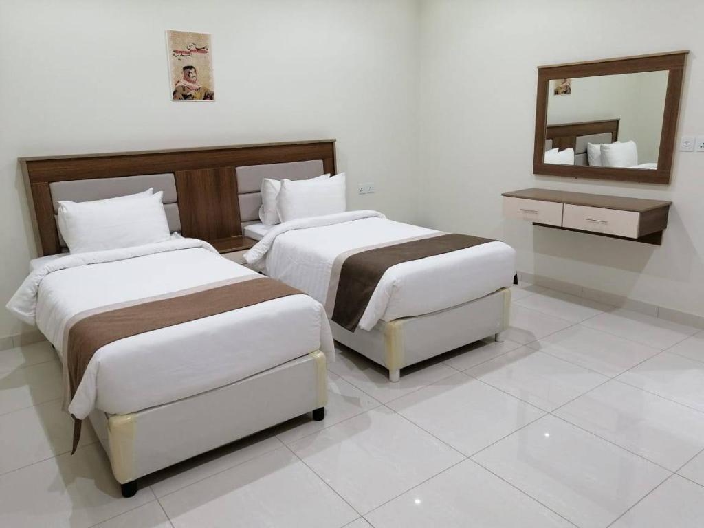 Postel nebo postele na pokoji v ubytování فندق نجمه الشمس