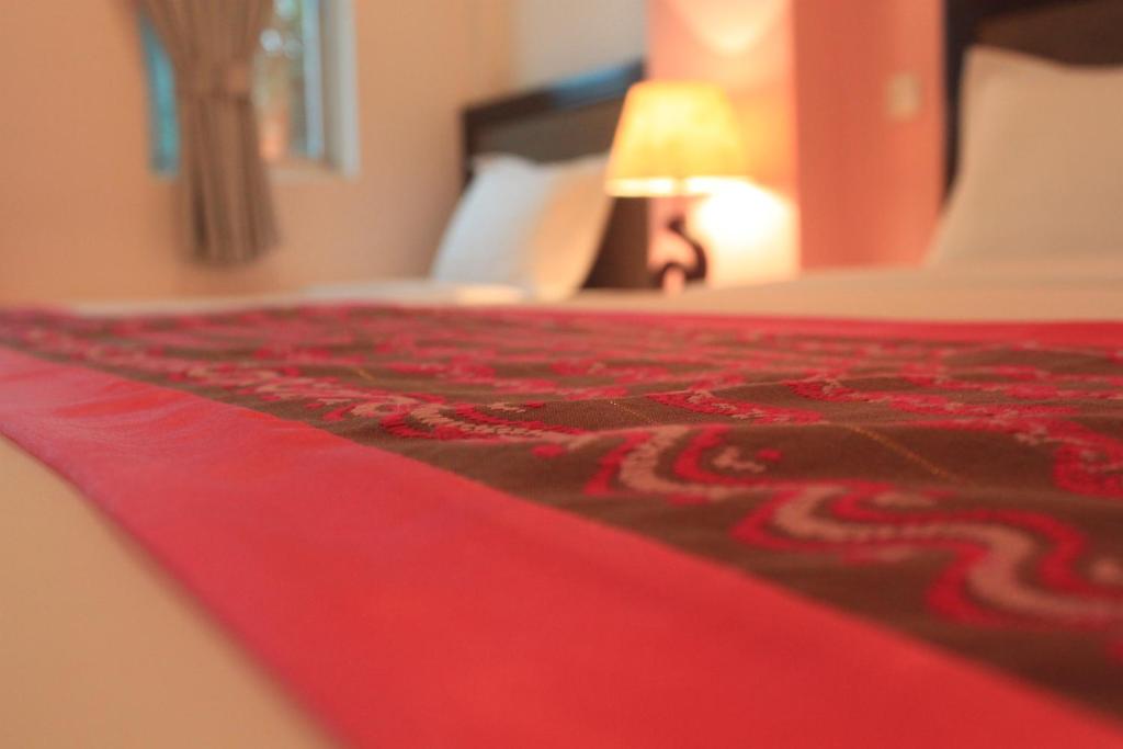 Postel nebo postele na pokoji v ubytování Grand Laurel Hotel