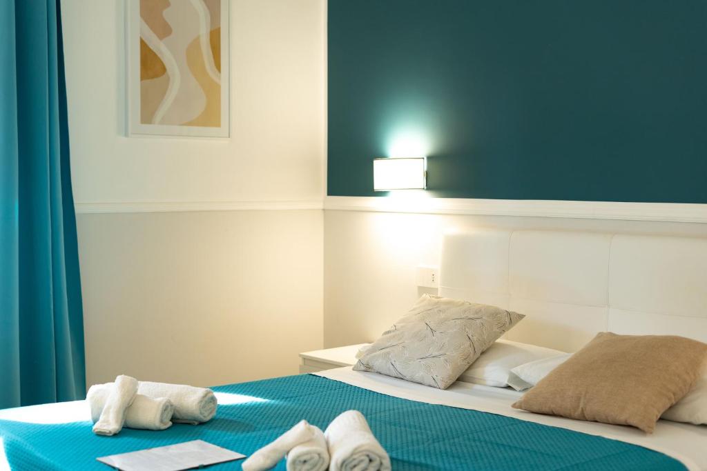 Postel nebo postele na pokoji v ubytování Royal Rooms Portici