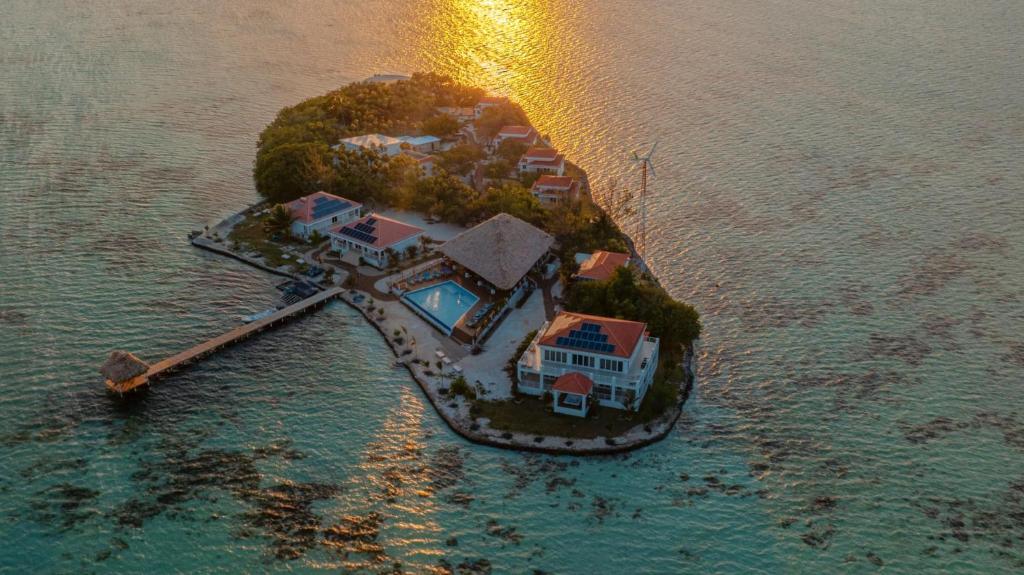 an aerial view of a house on an island in the water at Luxury All-Inclusive Prince Private Island in San Pedro Island