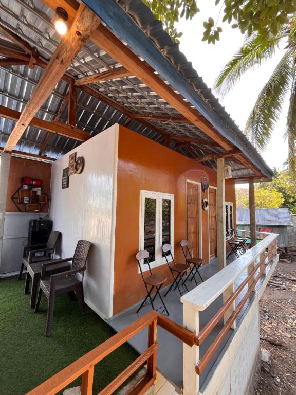 a small house with a pitched roof at Modo home in Komodo