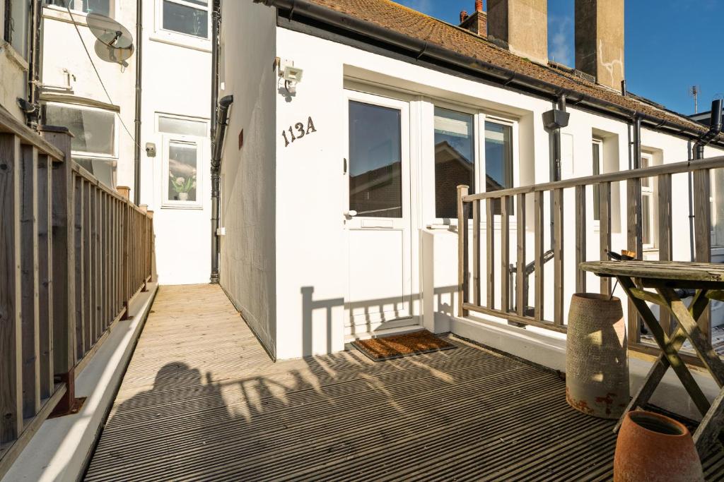 a front porch of a house with a white door at Sea Croft in Worthing