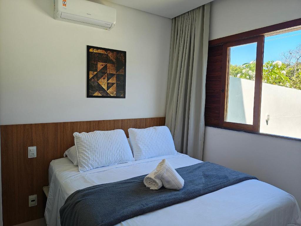 Postel nebo postele na pokoji v ubytování Aptos em cond. c/ Piscina e Churrasqueira, Imbassaí - FOSs