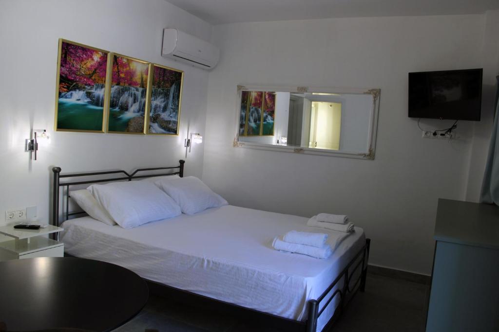 Postel nebo postele na pokoji v ubytování Aenaon Corfu Luxury Apartments #03 - Aris Apartment