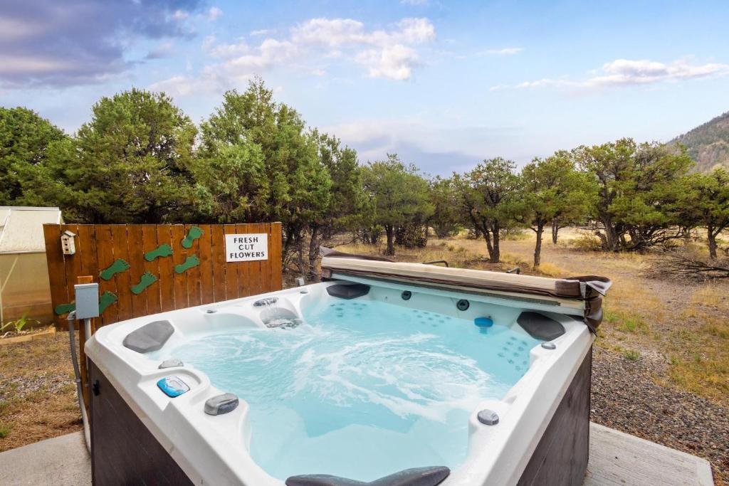 a hot tub in the middle of a field at The Shady Grove Retreat in South Fork
