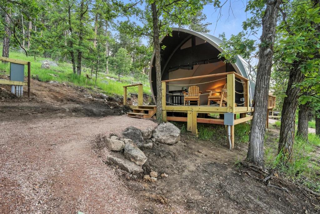 a tent in the middle of a forest at Escape to Cloud Nine Glamping in the Black Hills in Keystone